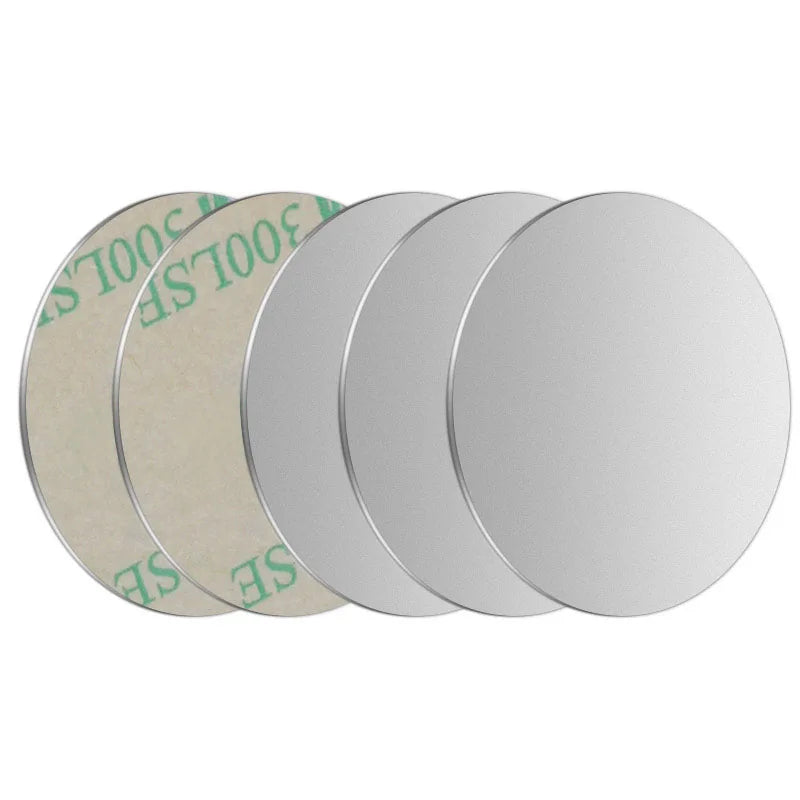 A set of four silver magnetic mount plates for phones and devices, showing different sizes.