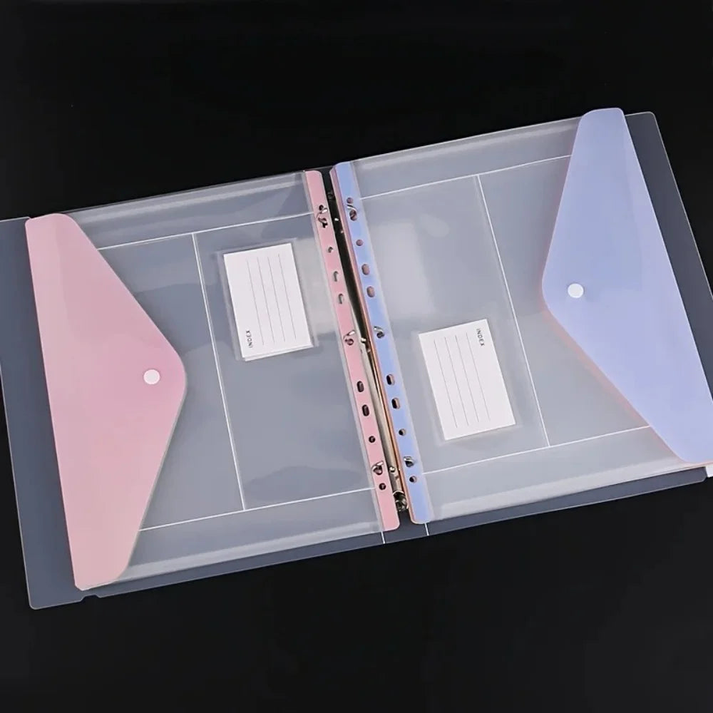 A clear plastic binder organizer tray with pink and purple pockets for holding ring binders.