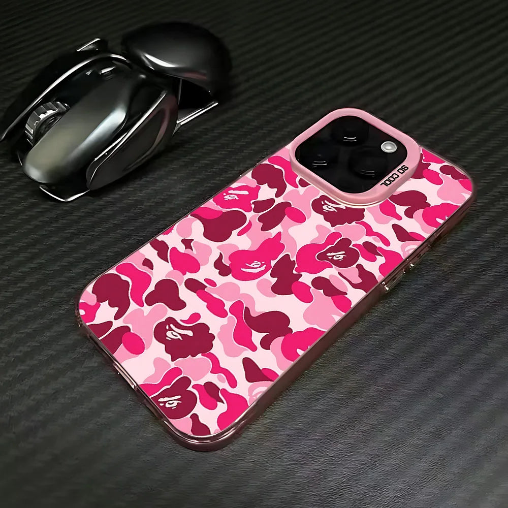 A pink leopard print anti-fall phone case for an iPhone is shown next to a black wireless mouse.