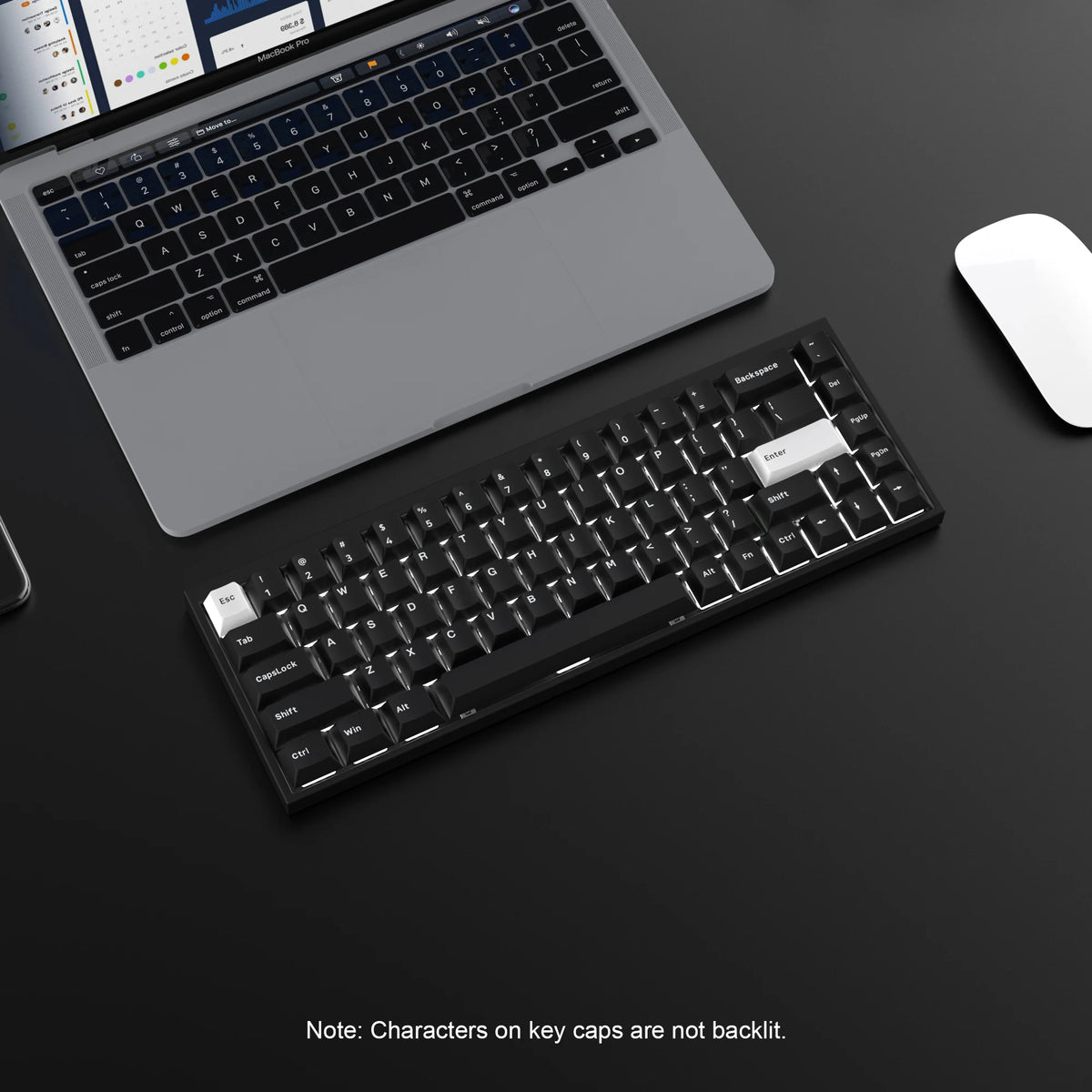 A close-up view of a black mechanical keyboard and laptop with a white mouse on a dark surface.