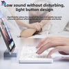 A hand is typing on a white foldable Bluetooth keyboard with a light button design.