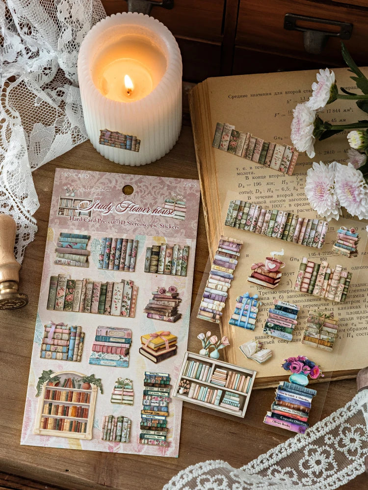 A flat lay of retro 3D relief book gallery stickers and related crafting materials on a wooden surface.