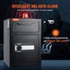 A black electronic safe with a keypad lock and an auto-alarm feature is shown next to a person wearing a black hood.
