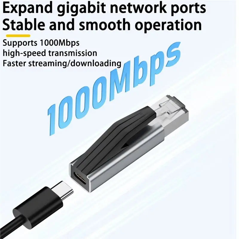 محول فضي من USB-C إلى إيثرنت يظهر موصولاً بكابل، مصمم لتوسيع منافذ الشبكة بسرعة جيجابت.