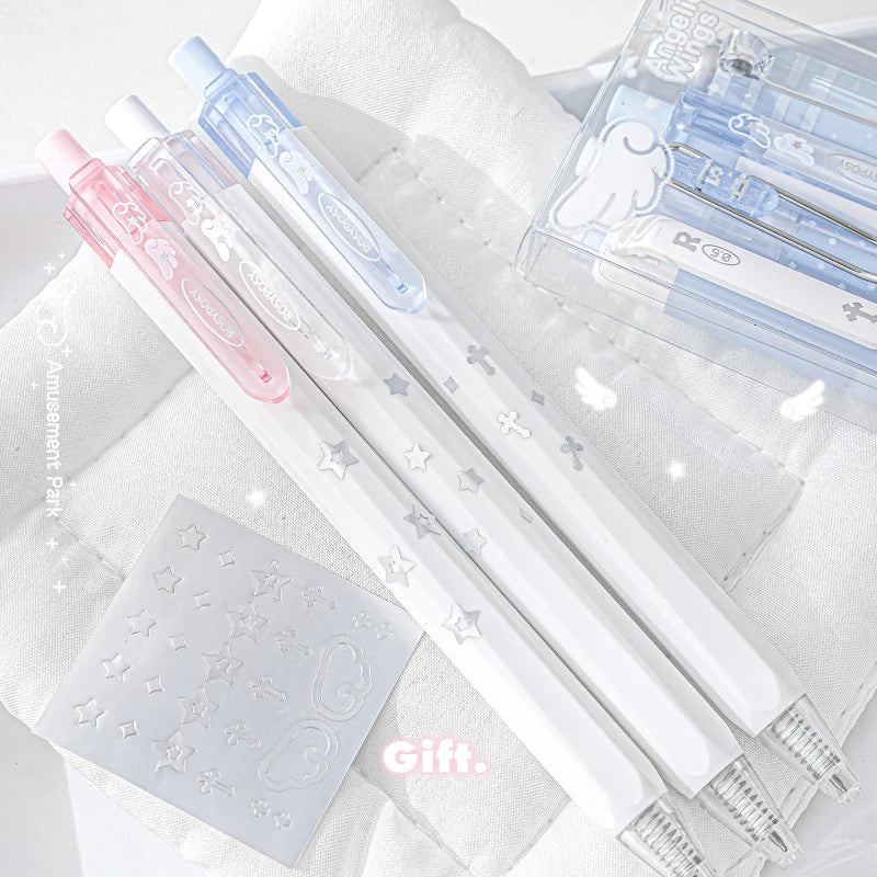 A set of four Kawaii Pearl Angel gel pens in various pastel colors and designs are displayed on a white towel.