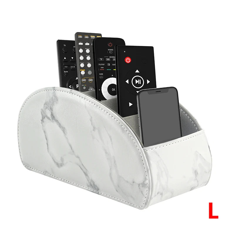A white marble PU leather caddy organizer holding a smartphone and several TV remotes.