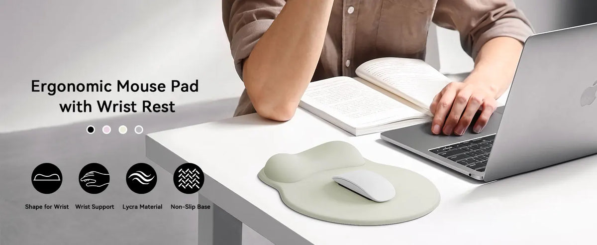 A hand is using an ergonomic mouse pad with wrist rest on a laptop, demonstrating wrist support.