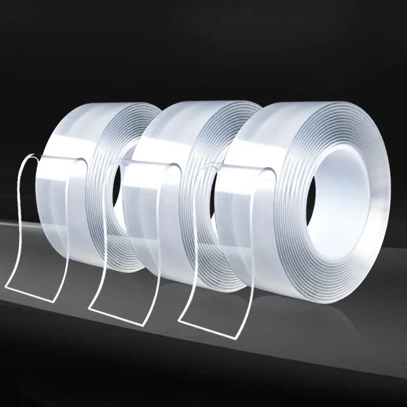 Three rolls of heavy duty clear double-sided gap tape are displayed on a dark surface.