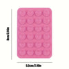 A pink multi-pack of silicone suction phone mounts with small circular holes.