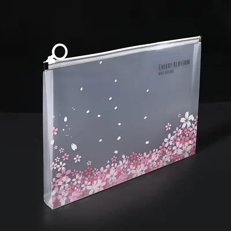 A transparent zipper file bag featuring a cherry blossom floral design on a gray background.