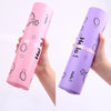 A hand holds a pink reusable plastic mailing bag with a Hello design and a purple reusable plastic mailing bag with a Hello d