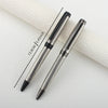 A silver metal ballpoint pen is shown diagonally on a white surface, with a measurement line indicating its length.