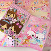 A set of pink and yellow decorative memo pads featuring cute animal characters and happy themes.