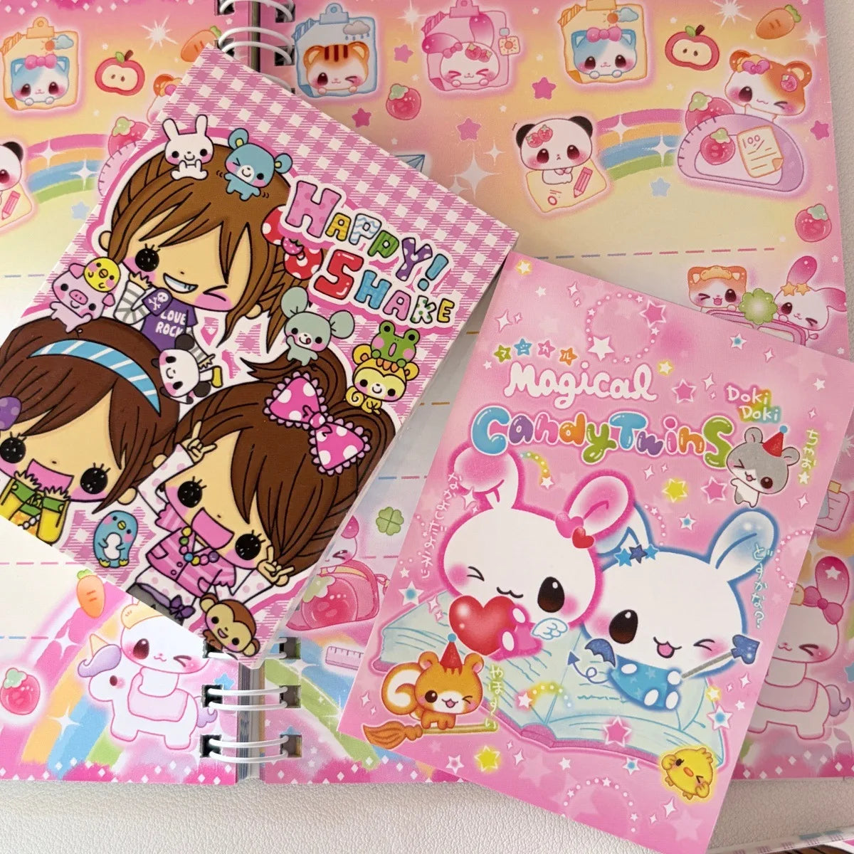 A set of pink and yellow decorative memo pads featuring cute animal characters and happy themes.