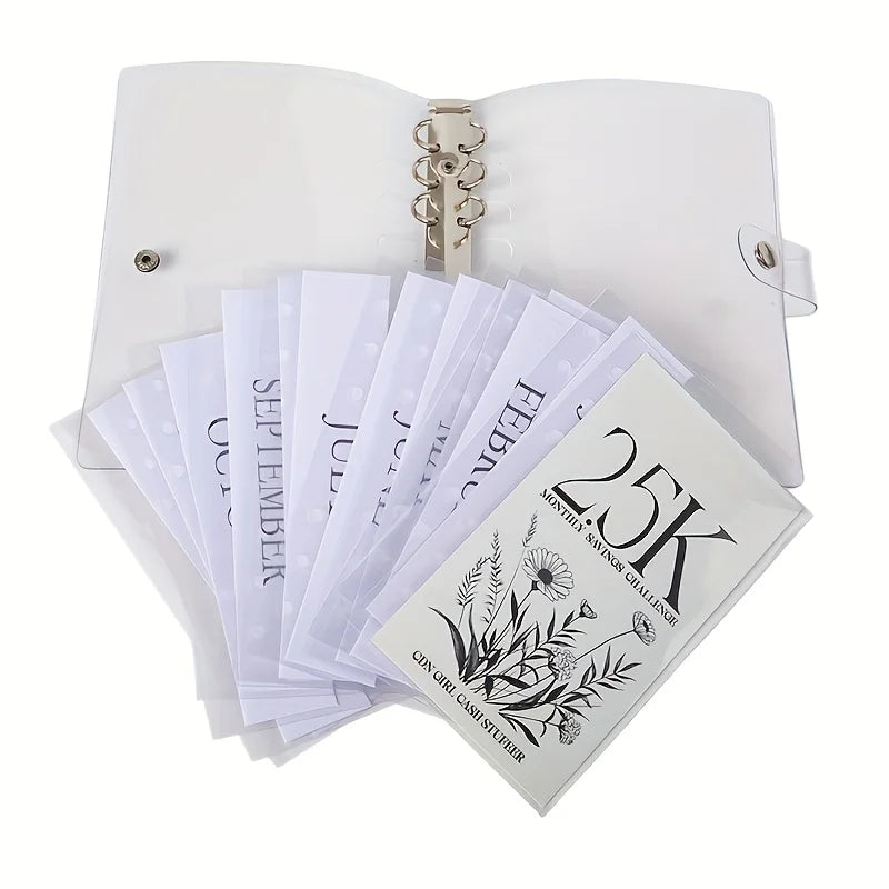 A clear binder set with multiple sheets of paper inside, featuring a 25K monthly savings challenge design.