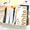 Une boîte blanche affichant un pack de six stylos gel noirs rétractables avec des accents dorés.
