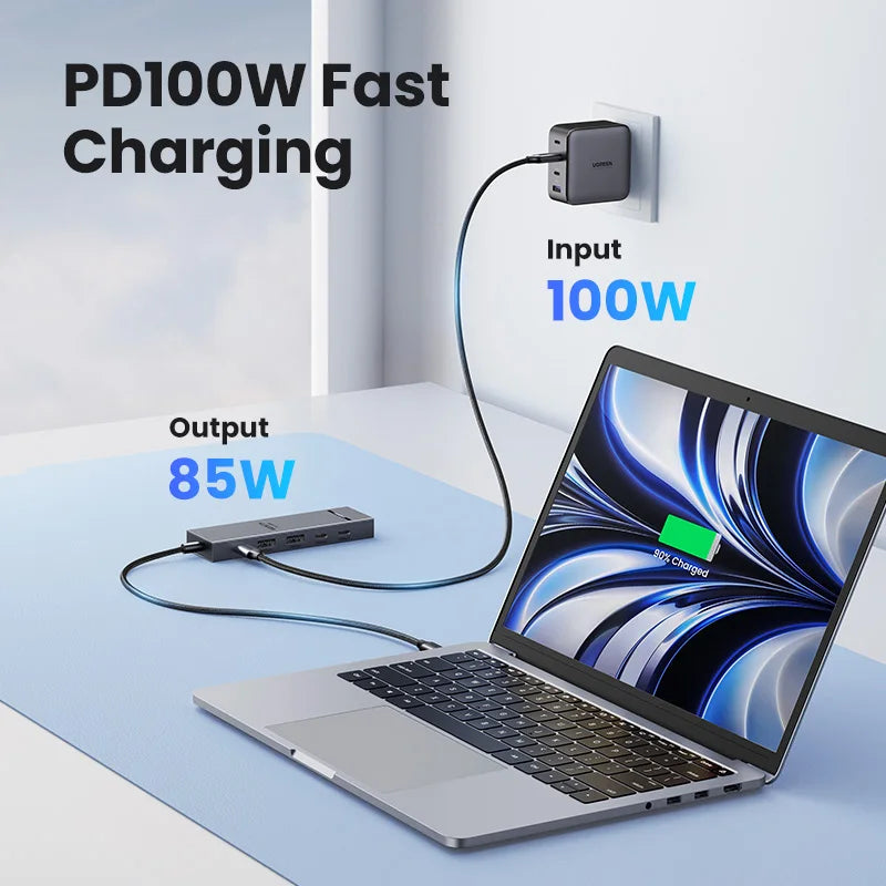 A laptop is shown receiving 85W output from a PD 100W fast charging adapter.