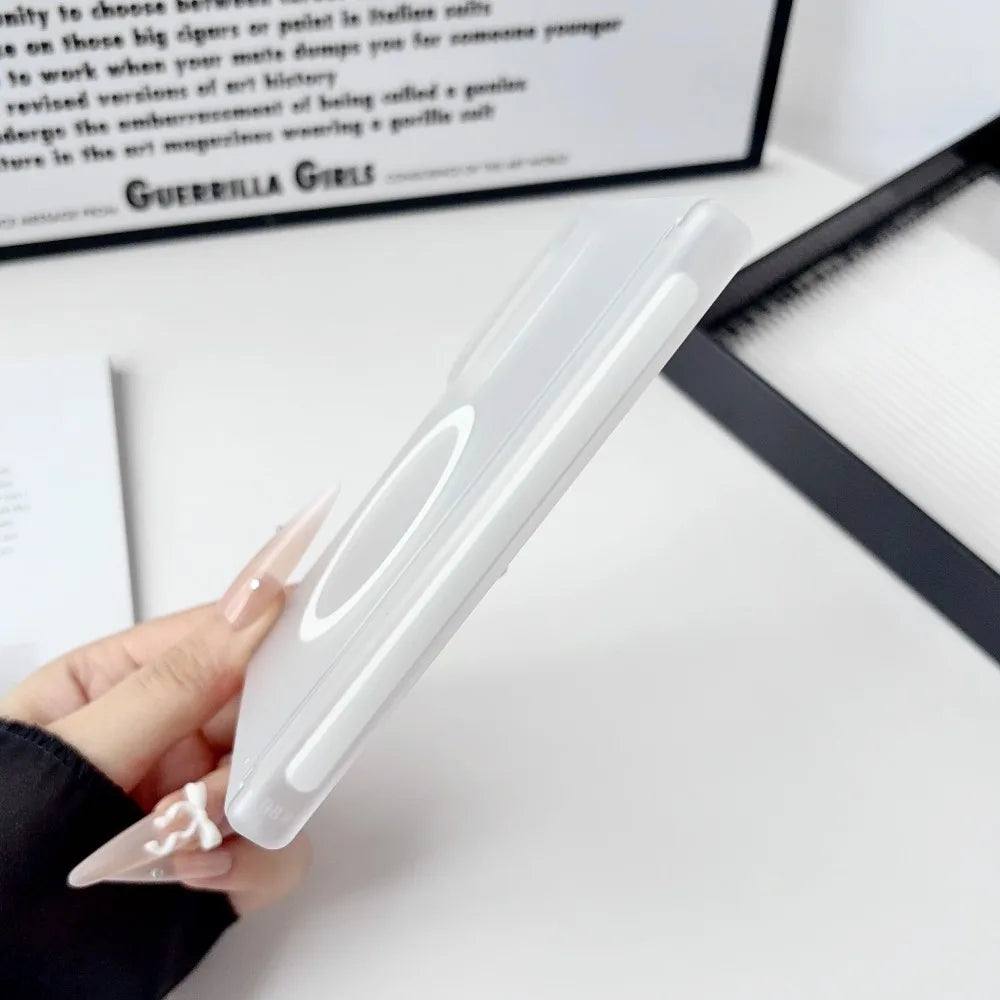 A hand holds a clear Samsung Galaxy Z Fold case with a magnetic hinge protection feature on a white surface.