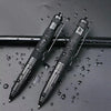 A pair of tactical aluminum pens are lying on a dark surface amidst water droplets.