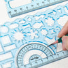 A hand uses a fine-tipped pen to draw on a clear plastic ruler set featuring various geometric shapes and measurement marking