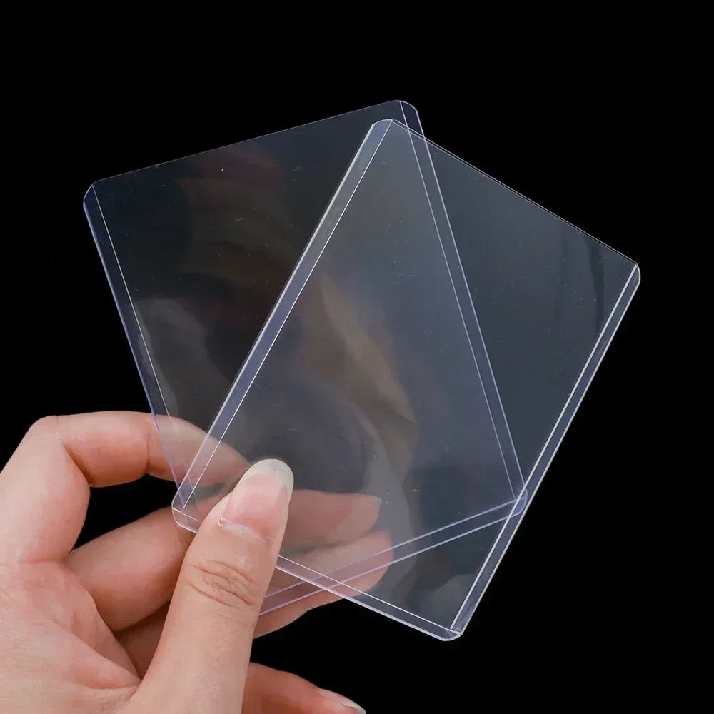 A hand holds a clear protective card sleeve with an anti-scratch film, showing its transparent and protective nature.