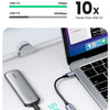 A silver USB-C to USB 3.0 OTG adapter is shown connected to a laptop, demonstrating super fast transmission speeds.