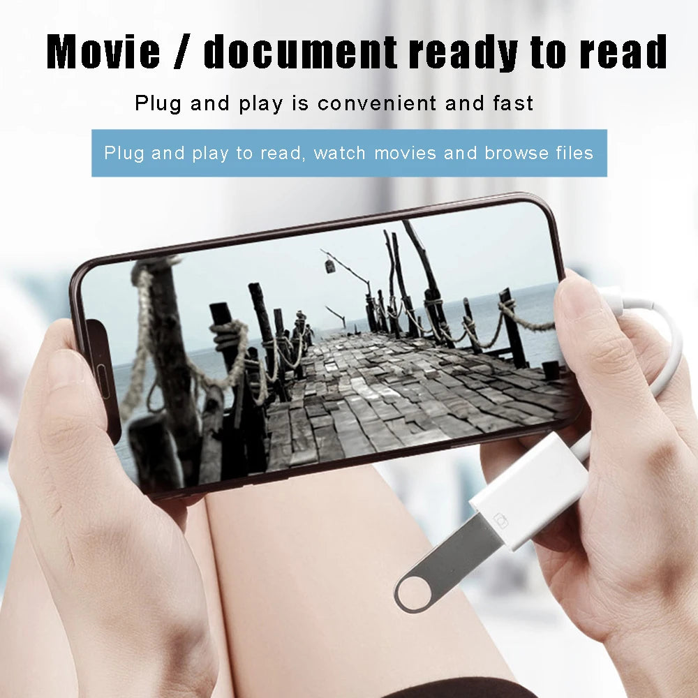A hand holds a smartphone connected to a adapter for data transfer.