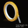 Roll of yellow heavy-duty double-sided cloth tape with a 1cm width and 5m total length