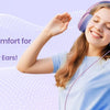 A smiling girl wearing purple wired headphones while playing, demonstrating feather-light comfort for all-day use.