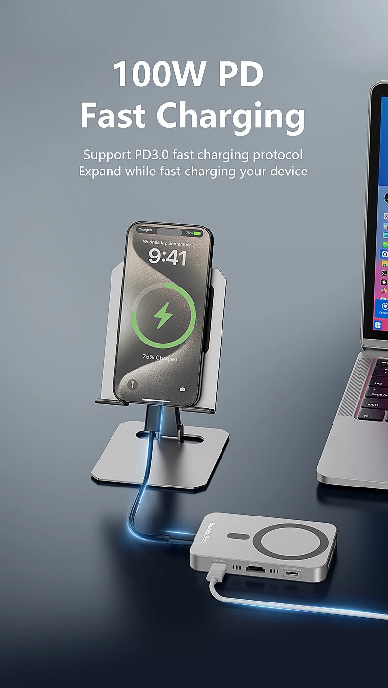 Un chargeur rapide 100W PD connectant un smartphone à un ordinateur portable, avec une station d'accueil NVMe SSD magnétique