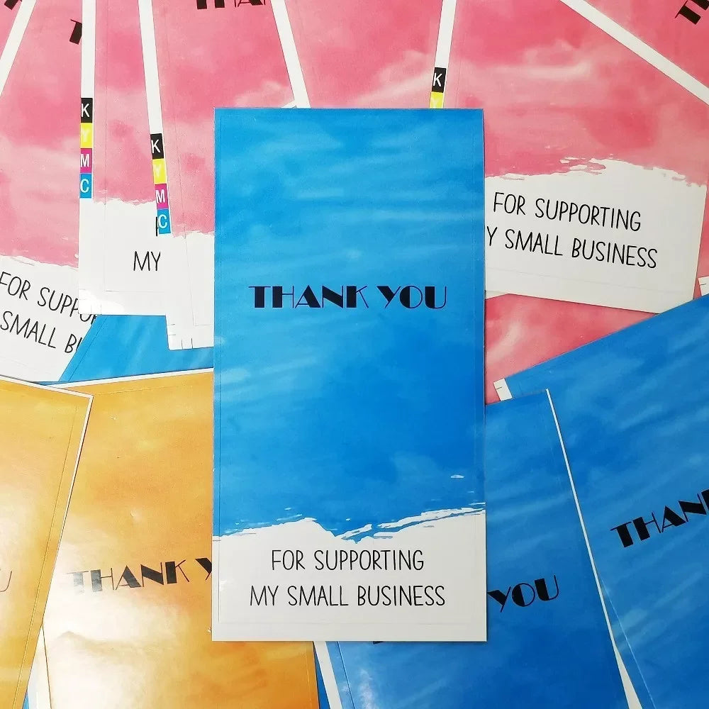 A collection of rectangular thank you stickers in pink, orange, and blue tones for small business packaging.