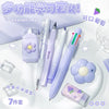 A set of purple and white cute cartoon school stationery items including pens and accessories.