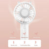 White mini handheld fan with three wind settings labeled gentle, natural, and strong