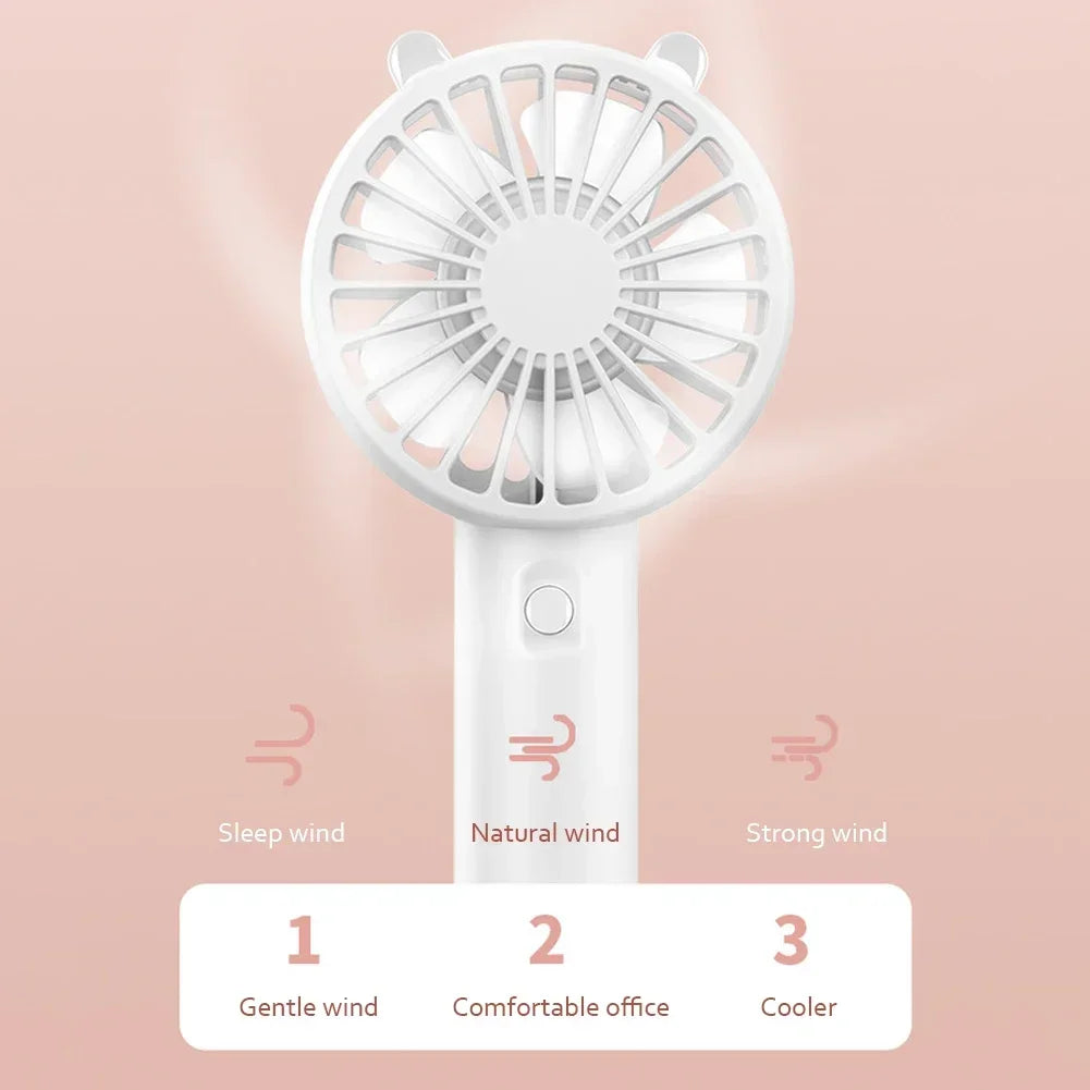 White mini handheld fan with three wind settings labeled gentle, natural, and strong