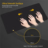A black ultra smooth mouse pad demonstrates preventing mouse movement and showing a super fine fiber braided material.