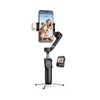 A black 3-axis smartphone gimbal stabilizer with a built-in selfie stick and a person being filmed.