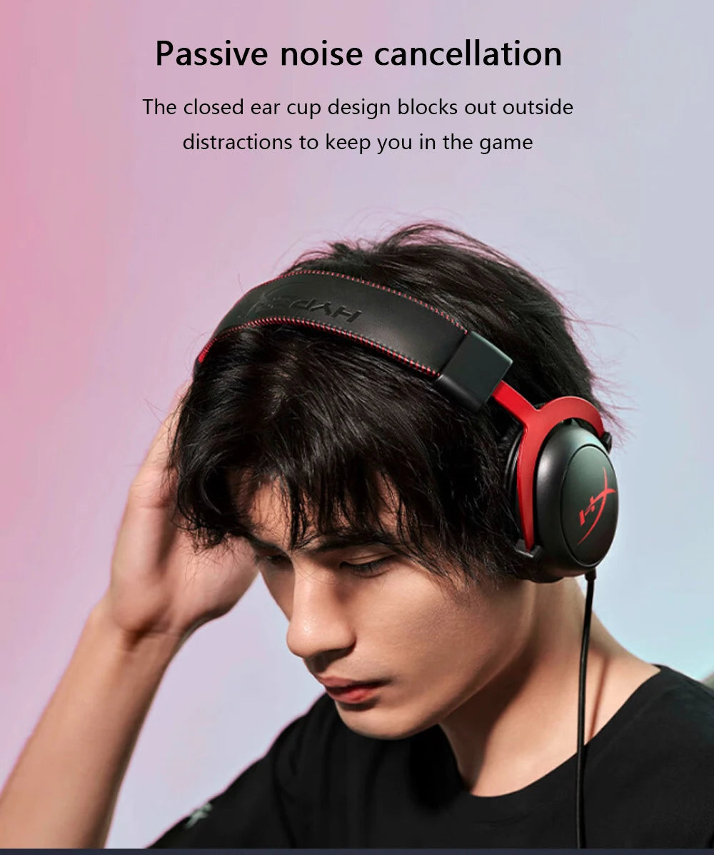 A close-up of a person wearing a black HyperX Cloud II wired gaming headset with red accents.
