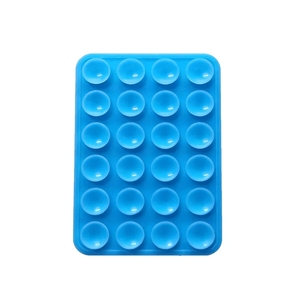 A blue silicone suction cup phone mount with multiple circular holes for mounting devices.