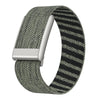 A close-up view of a dark gray and black striped nylon braided watch strap with a silver buckle.