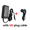 Black high-performance 65W laptop power adapter with a UK plug cable.