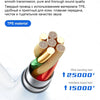 Close-up of gold and colored wires used in a wired earphone product test.