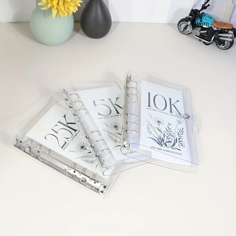 A set of goal-oriented savings binders showing 5K and 10K milestones with floral designs.