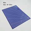 A blue art cutting tool with a size of 30 by 22 cm showing a grid pattern.
