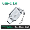 Lector de tarjetas USB-C 3.0 UGREEN plateado con carcasa de metal y cable adjunto.