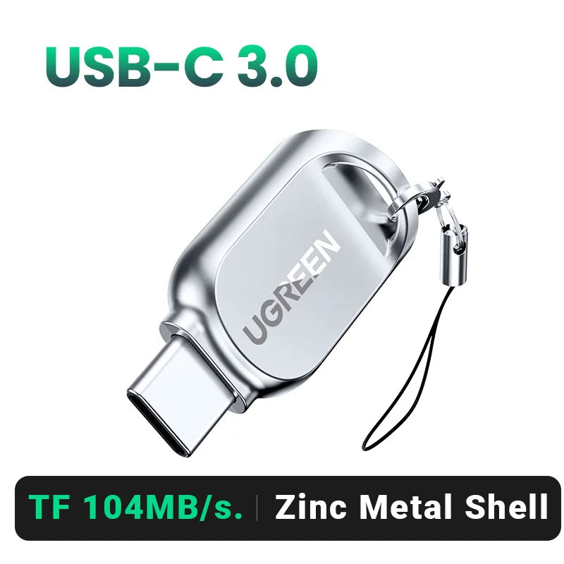 Lector de tarjetas USB-C 3.0 UGREEN plateado con carcasa de metal y cable adjunto.