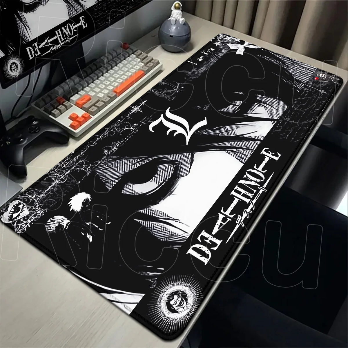 Black Death Note XXL mouse pad with a stylized skull design placed on a desk next to a keyboard.