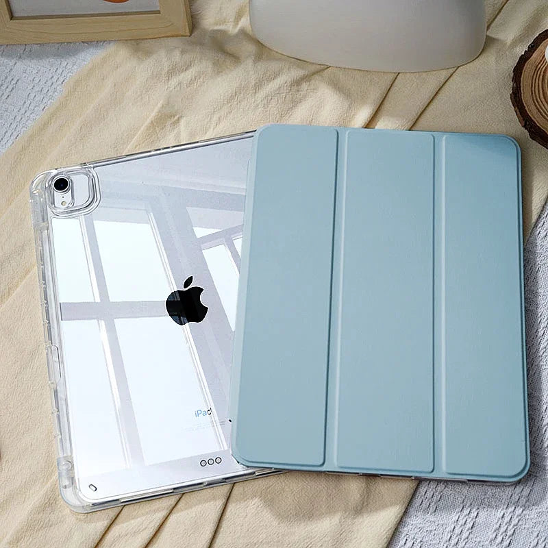 A light blue universal protective case for an Apple iPad is shown resting on a beige fabric.