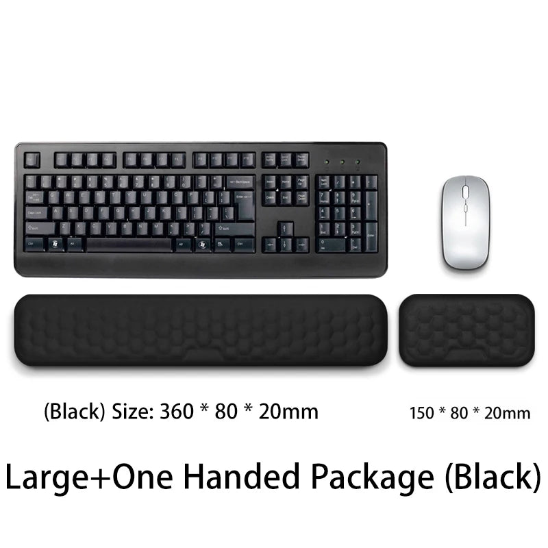 Black ergonomic keyboard and mouse with a wrist rest pad included in a large package