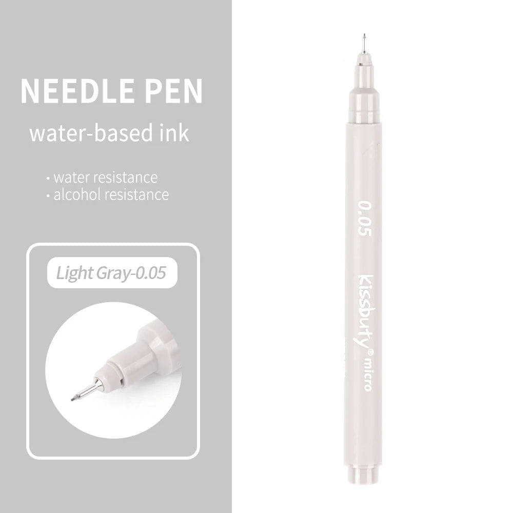 A light gray needle pen with a silver tip and a pink barrel is shown against a gray background.