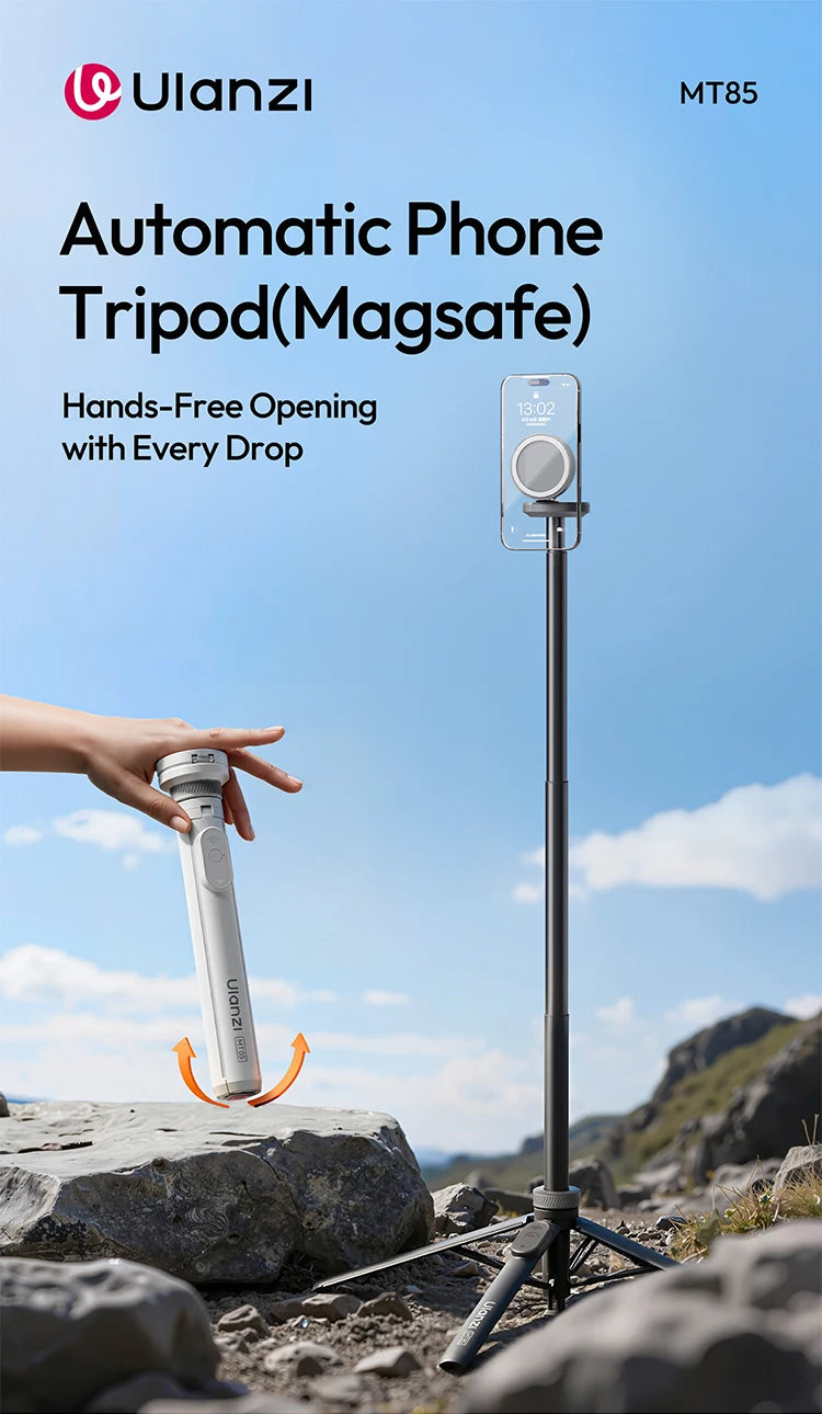 A hand is holding a Ulanzi automatic phone tripod with a Bluetooth controller in an outdoor rocky environment.